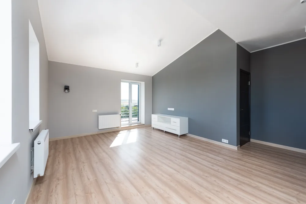 Empty, clean apartment with light wood floors, ready for new occupants